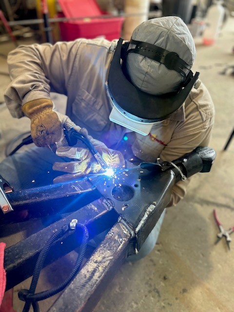 Permian Alliance welder working on a trailer